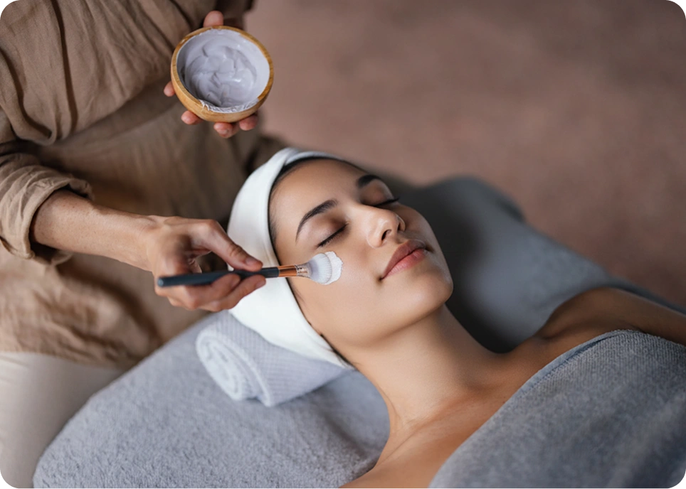 Woman receiving a facial beauty treatment.